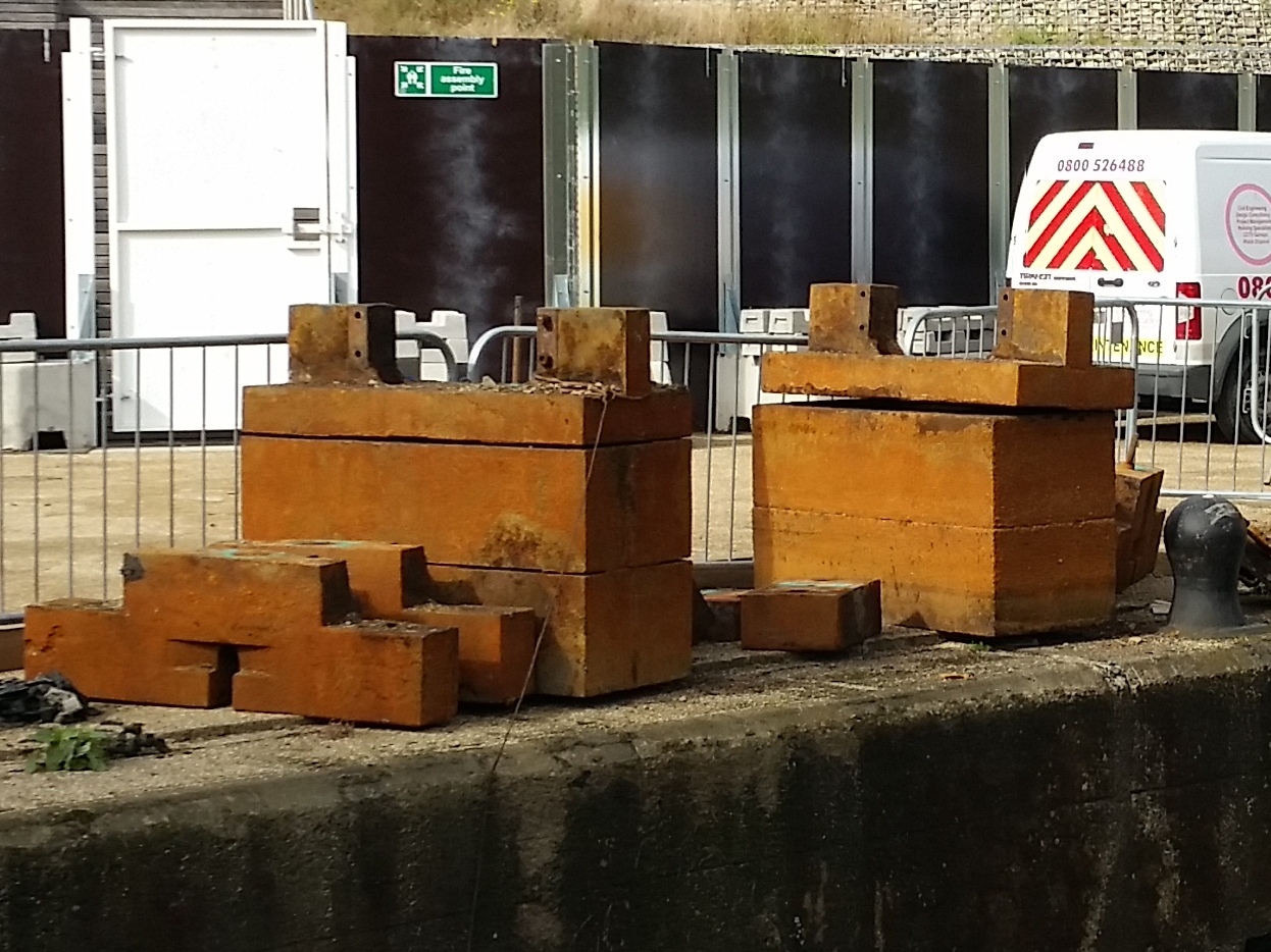 The metal counterweights from the old gates